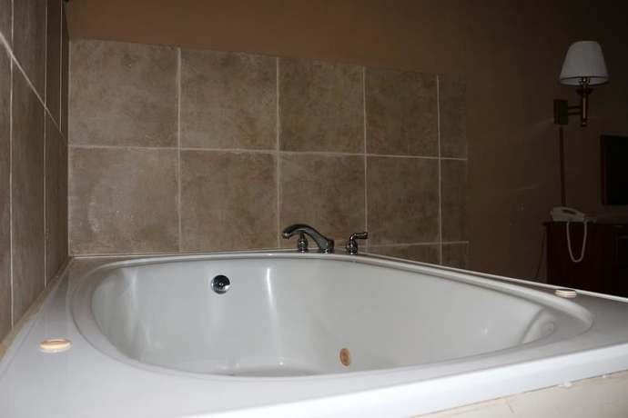 Imagen de la habitación del Hotel Magnolia Bay and Suites. Foto 11