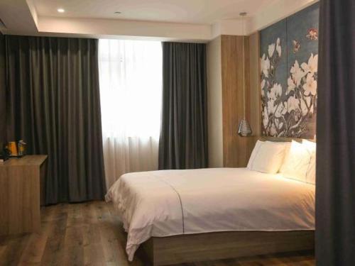 Imagen general del Hotel Magnolia Business Yangzhou Wanda Plaza Shunda Road. Foto 4
