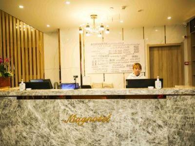 Imagen general del Hotel Magnolia Business Yangzhou Wanda Plaza Shunda Road. Foto 8
