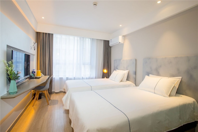 Imagen de la habitación del Hotel Magnotel Harbin Songbei Wanda Tourism Zone. Foto 8