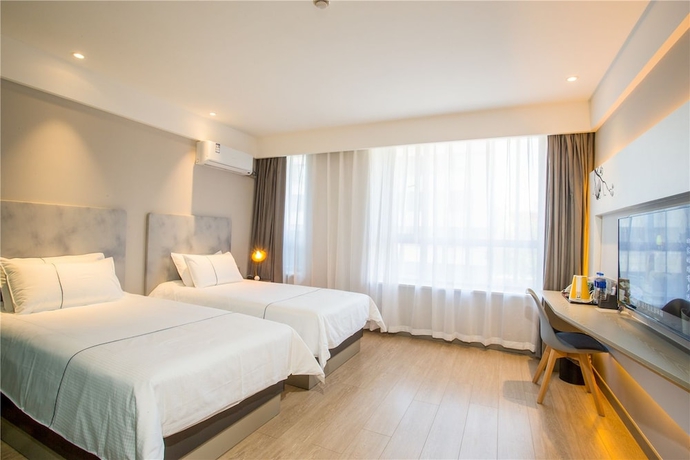 Imagen de la habitación del Hotel Magnotel Harbin Songbei Wanda Tourism Zone. Foto 9