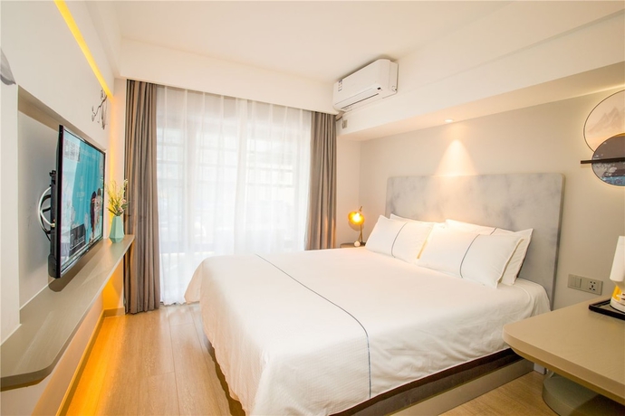 Imagen de la habitación del Hotel Magnotel Harbin Songbei Wanda Tourism Zone. Foto 11