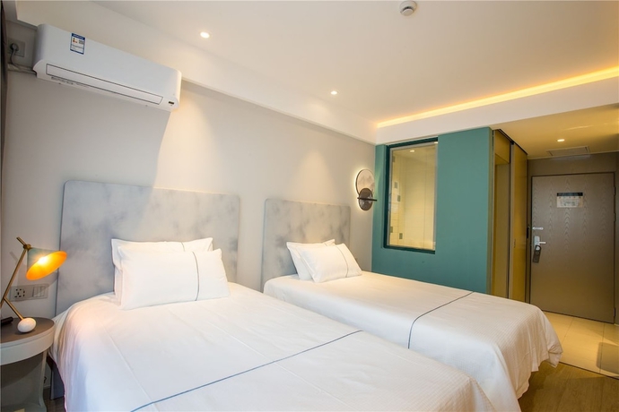 Imagen de la habitación del Hotel Magnotel Harbin Songbei Wanda Tourism Zone. Foto 13