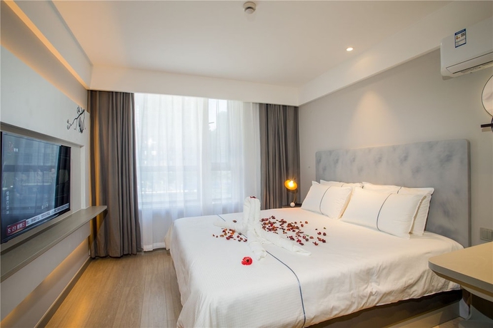 Imagen de la habitación del Hotel Magnotel Harbin Songbei Wanda Tourism Zone. Foto 14