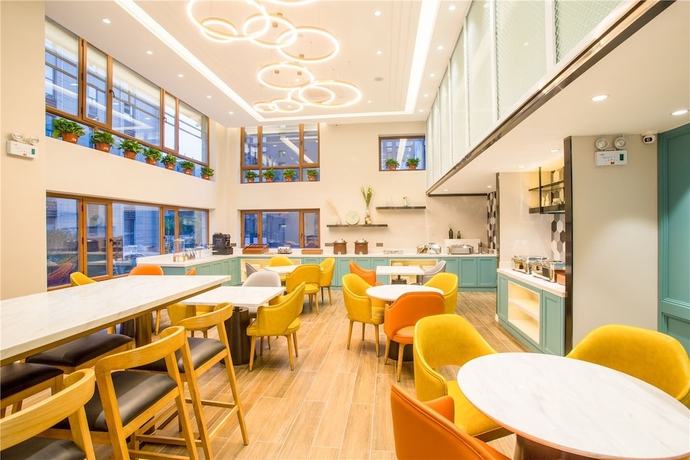 Imagen del bar/restaurante del Hotel Magnotel Harbin Songbei Wanda Tourism Zone. Foto 6