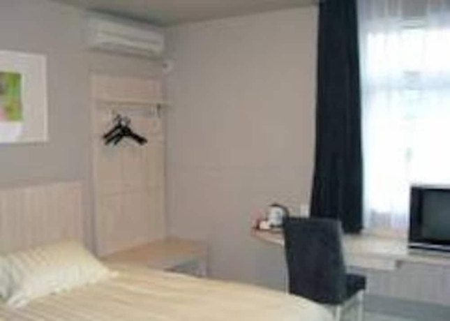 Imagen de la habitación del Hotel Magnotel Hotel Xiamen University Shimao Twin Tower. Foto 2