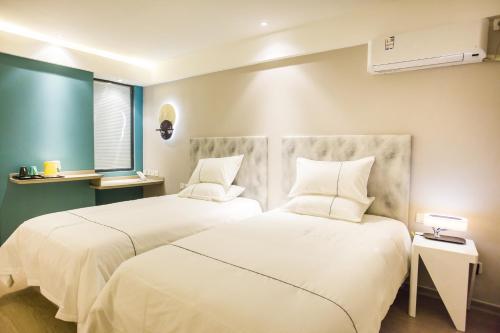 Imagen de la habitación del Hotel Magnotel Huizhou South Railway Station. Foto 6