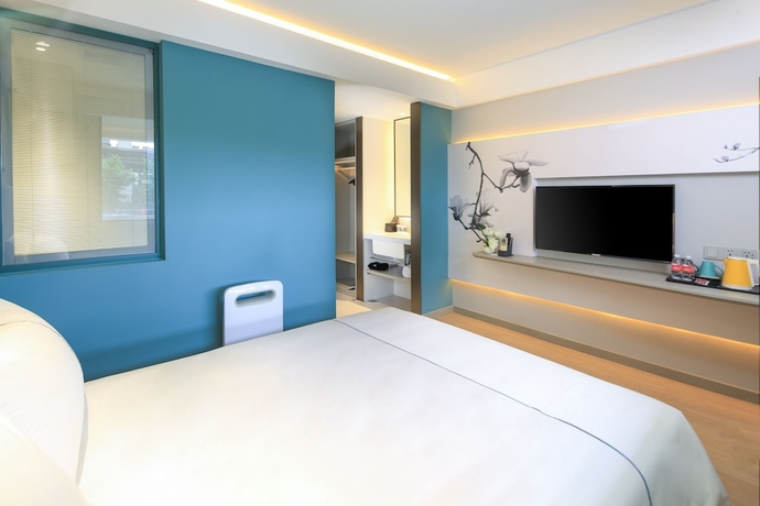 Imagen de la habitación del Hotel Magnotel Of Shanghai Jinjiang Park. Foto 9