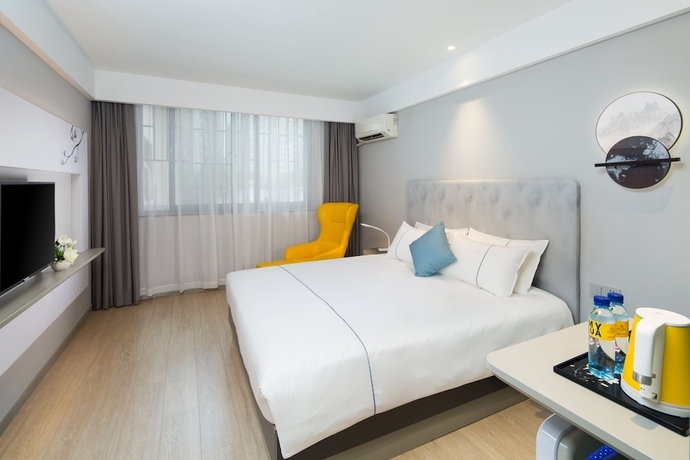 Imagen de la habitación del Hotel Magnotel Of Shanghai Jinjiang Park. Foto 10