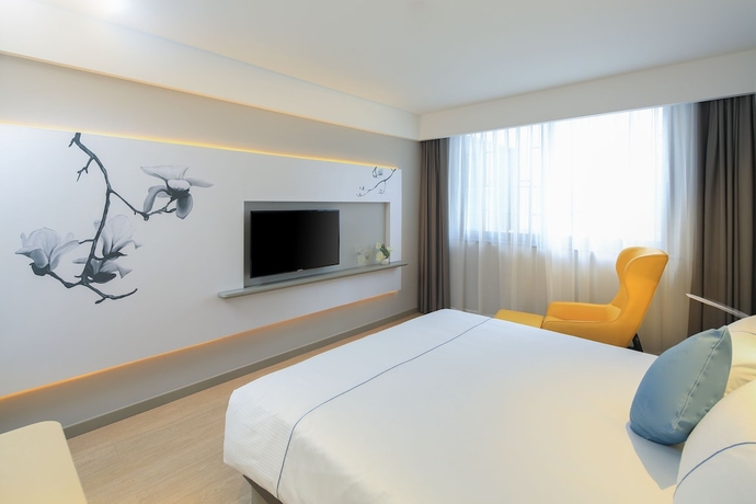Imagen de la habitación del Hotel Magnotel Of Shanghai Jinjiang Park. Foto 11