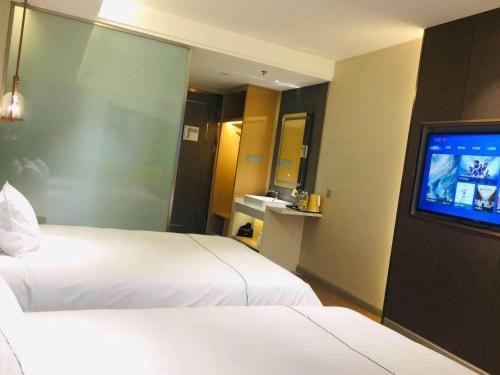 Imagen general del Hotel Magnotel YangZhou China Grand Canal Museum Wanda Plaza. Foto 12