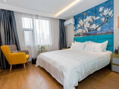 Imagen de la habitación del Hotel Magnotel YangZhou China Grand Canal Museum Wanda Plaza. Foto 14