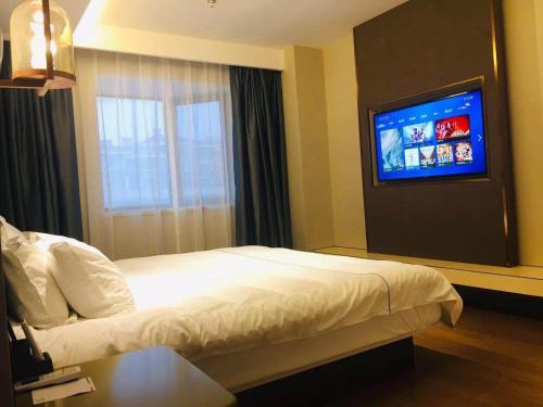 Imagen de la habitación del Hotel Magnotel YangZhou China Grand Canal Museum Wanda Plaza. Foto 19