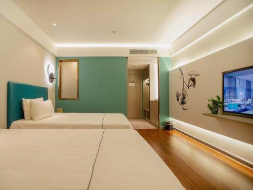 Imagen general del Hotel Magnotel Yangzhou Jinghua Wangyue Road. Foto 1