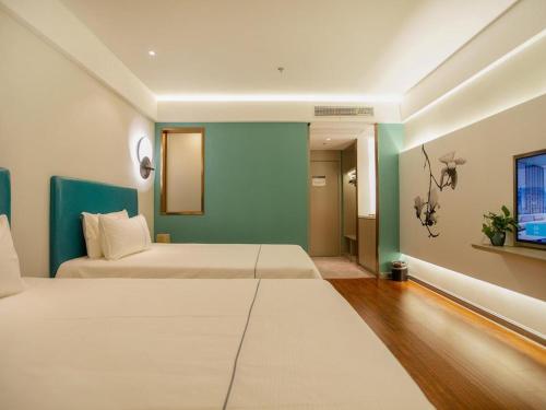 Imagen de la habitación del Hotel Magnotel Yangzhou Jinghua Wangyue Road. Foto 17