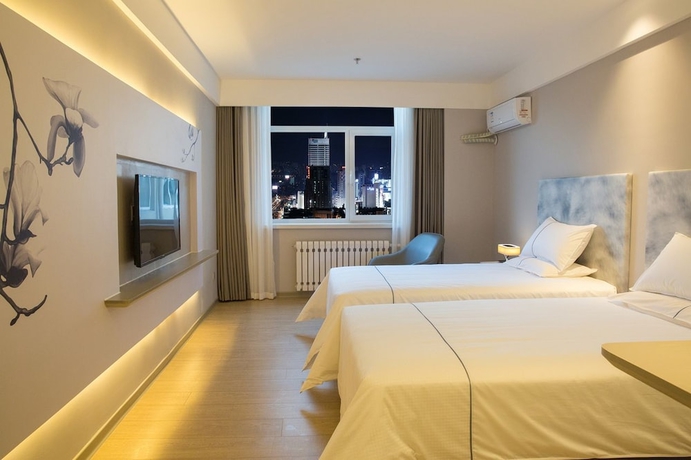 Imagen de la habitación del Hotel Magnotel the city government huludao. Foto 7