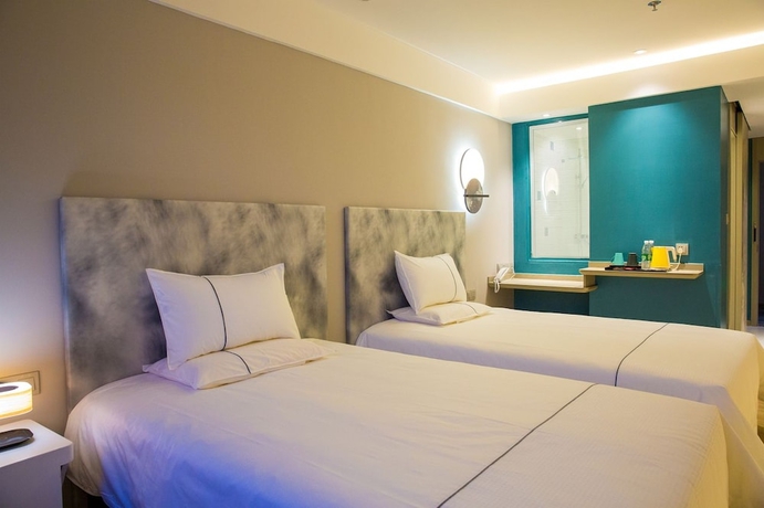 Imagen de la habitación del Hotel Magnotel the city government huludao. Foto 8