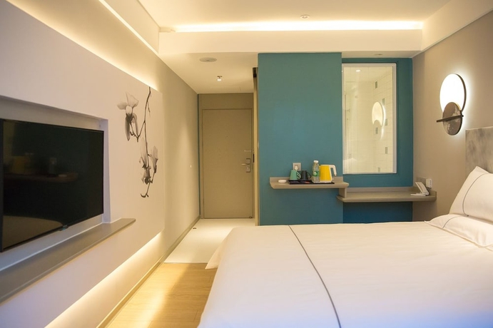 Imagen de la habitación del Hotel Magnotel the city government huludao. Foto 9