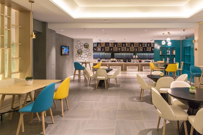 Imagen del bar/restaurante del Hotel Magnotel the city government huludao. Foto 5