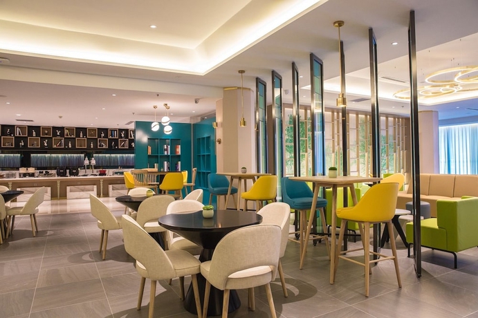 Imagen del bar/restaurante del Hotel Magnotel the city government huludao. Foto 6