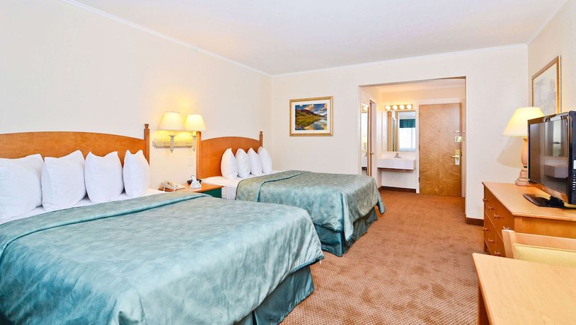 Imagen de la habitación del Hotel Magnuson Grand Pioneer Inn And Suites. Foto 5