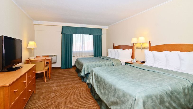 Imagen de la habitación del Hotel Magnuson Grand Pioneer Inn And Suites. Foto 9