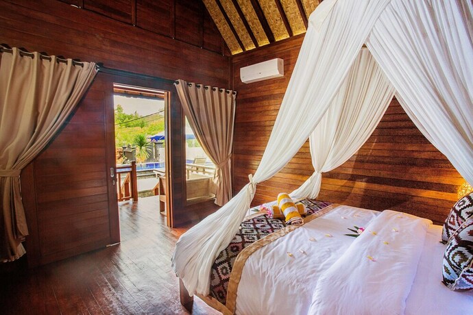 Imagen de la habitación del Hotel Maha Guru Huts. Foto 21