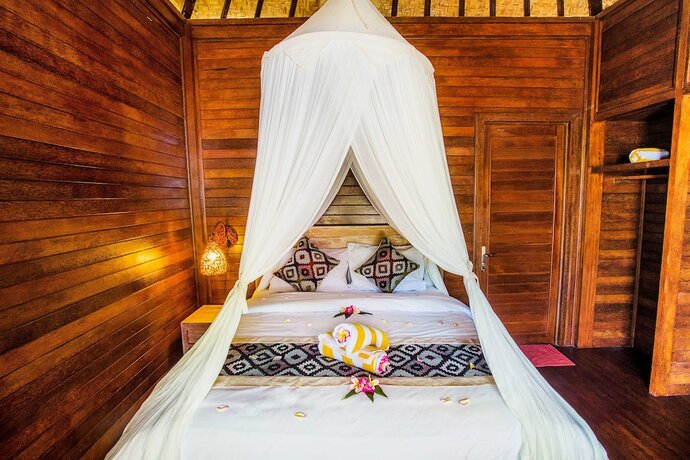 Imagen de la habitación del Hotel Maha Guru Huts. Foto 23