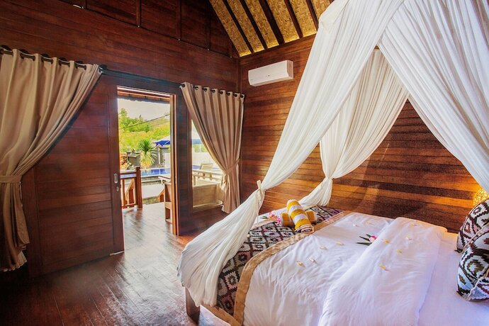 Imagen de la habitación del Hotel Maha Guru Huts. Foto 25