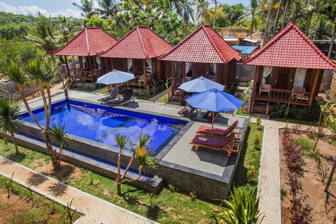 Imagen de la piscina del Hotel Maha Guru Huts. Foto 32