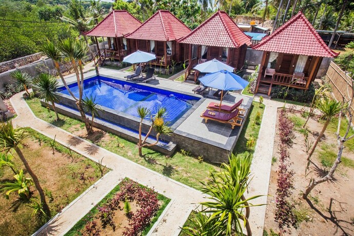 Imagen de la piscina del Hotel Maha Guru Huts. Foto 37