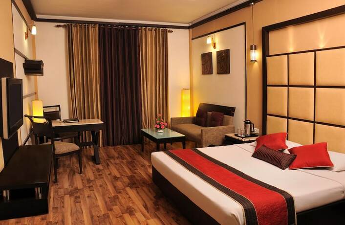 Imagen de la habitación del Hotel Maharaja Regency, Ludhiana. Foto 11