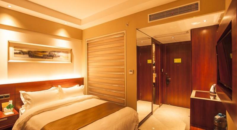 Imagen de la habitación del Hotel MaiXinGe International Hotel. Foto 4