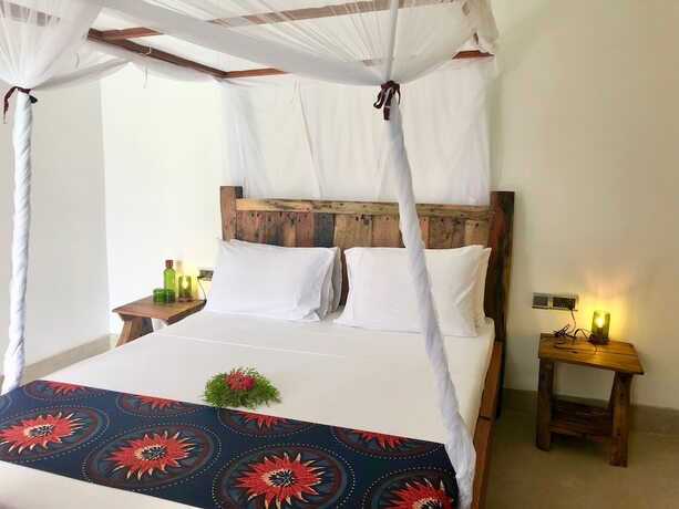 Imagen de la habitación del Hotel Maisha Nungwi. Foto 18