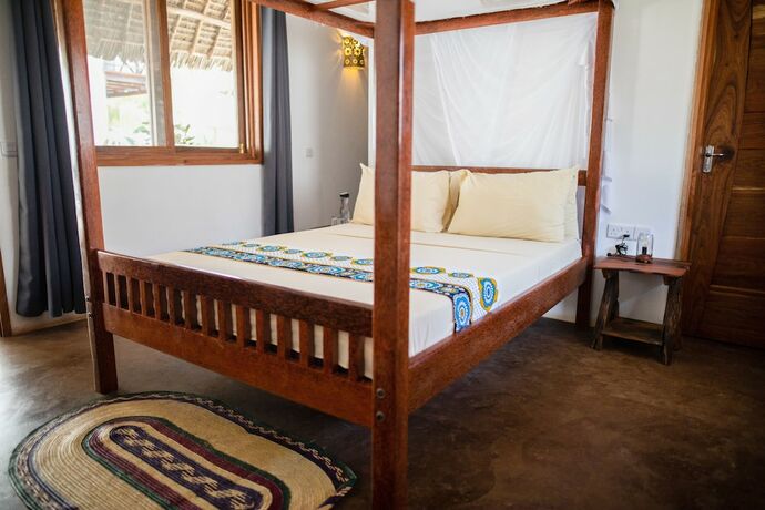 Imagen de la habitación del Hotel Maisha Nungwi. Foto 19