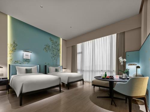 Imagen de la habitación del Hotel Maison Albars Leshan. Foto 16