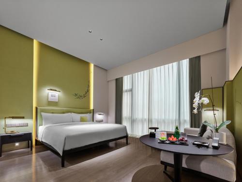 Imagen de la habitación del Hotel Maison Albars Leshan. Foto 17