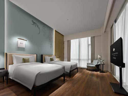 Imagen de la habitación del Hotel Maison Albars Leshan. Foto 18