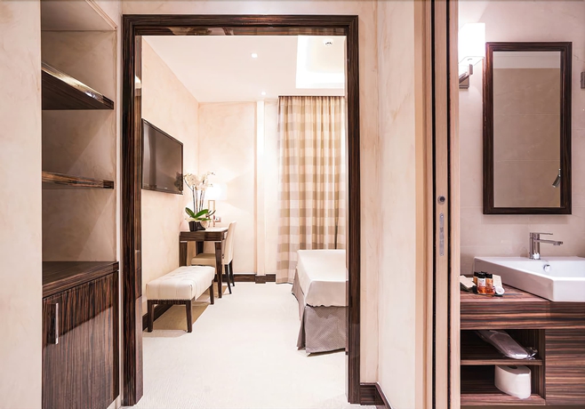 Imagen de la habitación del Hotel Maison Candia Luxury House. Foto 11