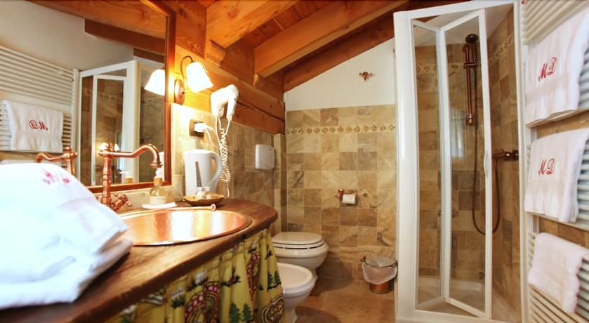 Imagen de la habitación del Hotel Maison Dominique. Foto 14