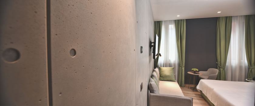 Imagen de la habitación del Hotel Maison Ducal. Foto 8