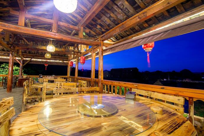 Imagen del bar/restaurante del Hotel Maison Heritage Liao Liao Xin Resort Puzhehei. Foto 19