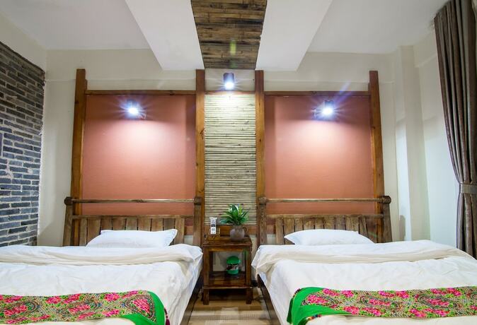 Imagen de la habitación del Hotel Maison Heritage Liao Liao Xin Resort Puzhehei. Foto 20