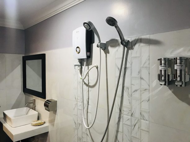 Imagen de la habitación del Hotel Maison Rivera Guest House. Foto 16