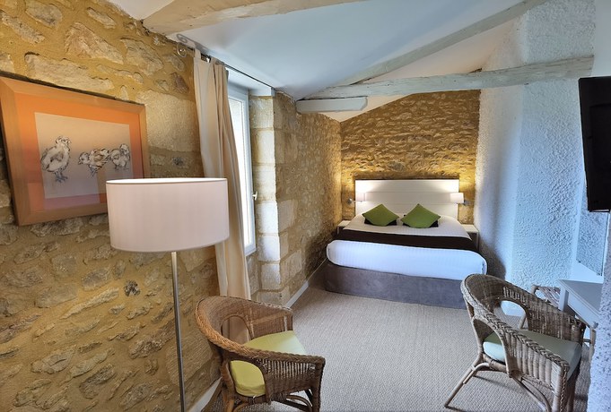 Imagen de la habitación del Hotel Maison des Peyrat. Foto 13