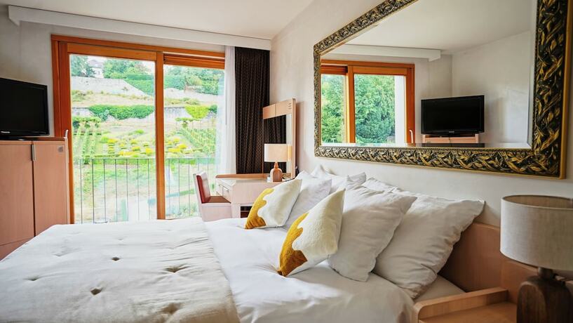 Imagen de la habitación del Hotel Maison du Lac Boutique. Foto 17