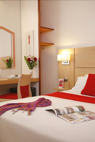 Imagen de la habitación del Hotel Maisons Du Monde and Suites - La Rochelle Vieux Port. Foto 11