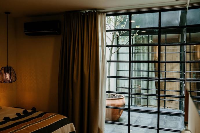 Imagen de la habitación del Hotel Majagua Boutique Adults Only. Foto 15