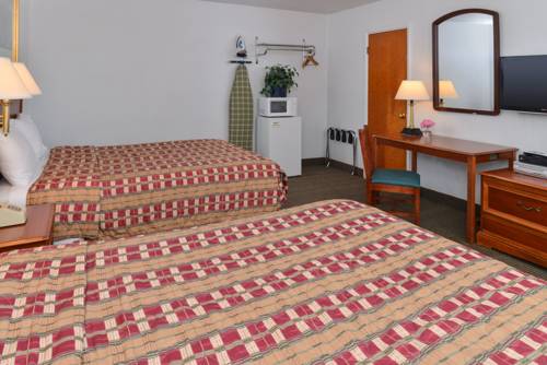 Imagen de la habitación del Hotel Majestic Inn and Suites. Foto 13