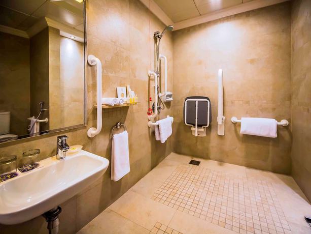 Imagen de la habitación del Hotel Majlis Grand Mercure Residence Abu Dhabi. Foto 10